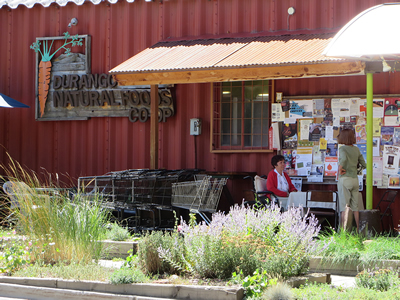 Pat seaking with DNF member, front of Co-op